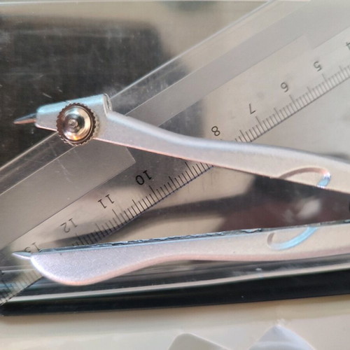 Geometry set like new with compass, protractor, ruler, and pencil