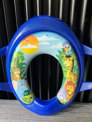 Child toilet seat used with handles and soft cushion