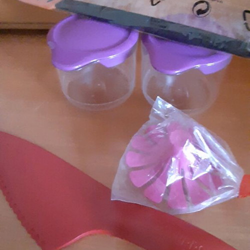 Tupperware product set new with collectible spatula and small cups