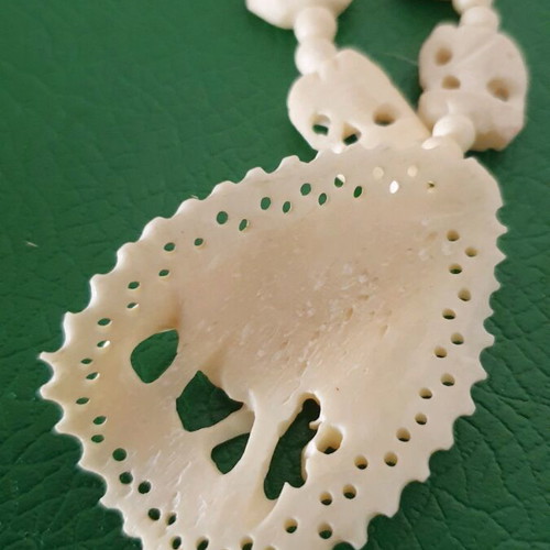 Carved vintage bone necklace with elephant pendant