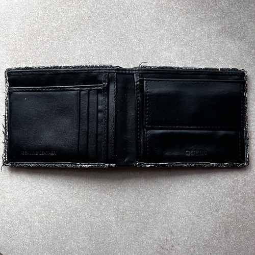 Guess wallet used with visible wear, black