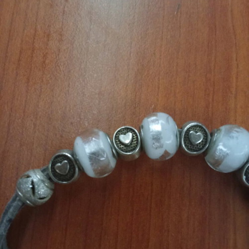 Silver bracelet like new with hearts and glass beads