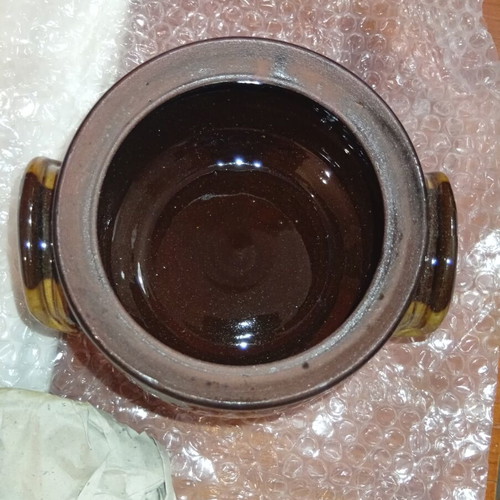 Traditional ceramic clay pot with lid and side handles
