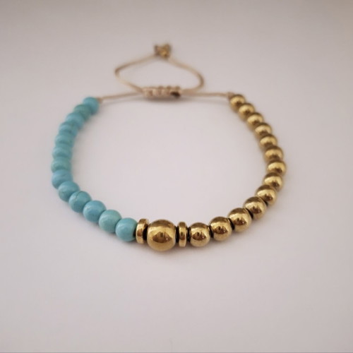 Bracelet with turquoise and gold beads, adjustable cord