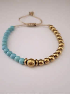 Bracelet with turquoise and gold beads, adjustable cord