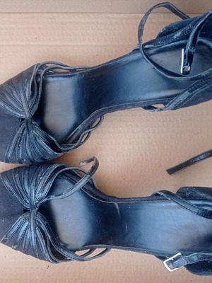 Black sandals used with wear on straps and back