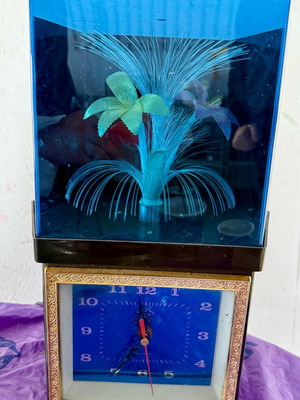 Vintage clock with optical fibers and rotating flower used