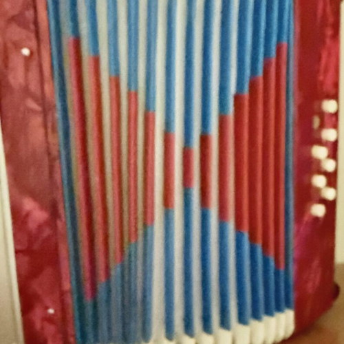 Children's accordion used, red with blue and red bellows