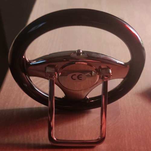 Clock shaped like a steering wheel with stand like new