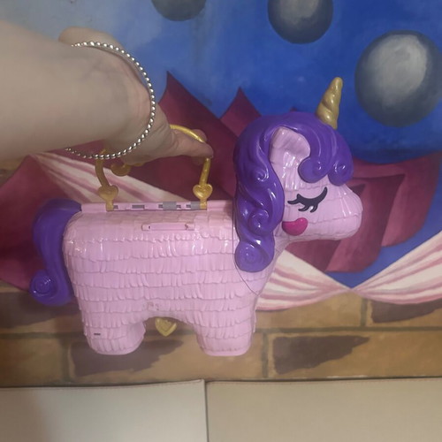 Polly Pocket Unicorn Party Playset used by Mattel