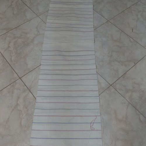 Traditional cotton fabric on loom, new, white with colorful stripes