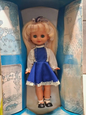 Vintage doll in original box with wear on dress and box
