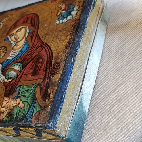 Cardboard box with silk-screened religious icon on canvas