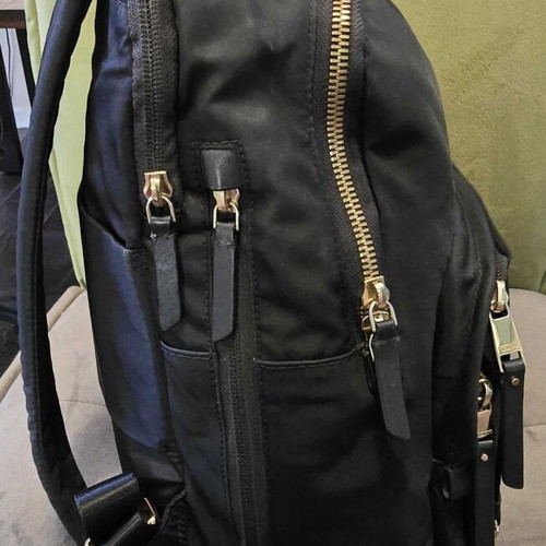 Tumi backpack used, black with gold details