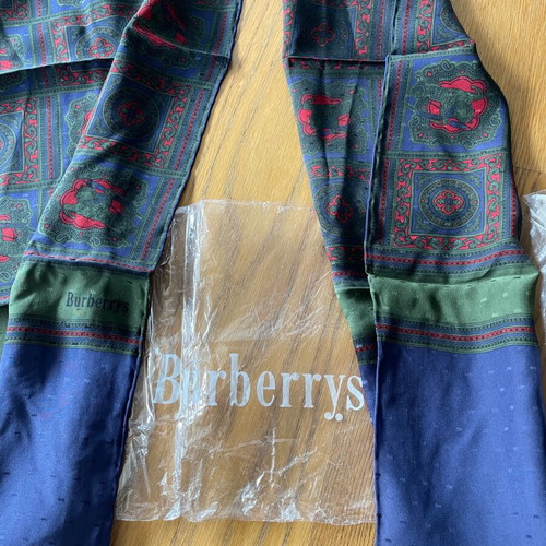 Burberry’s men's silk scarf new with beautiful patterns