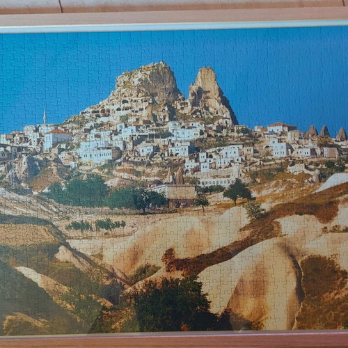 Framed puzzle like new, dimensions 0.53x0.73 m