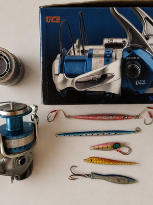 TICA Scrambler SS10000 fishing reel like new with extra spool and 5 lures