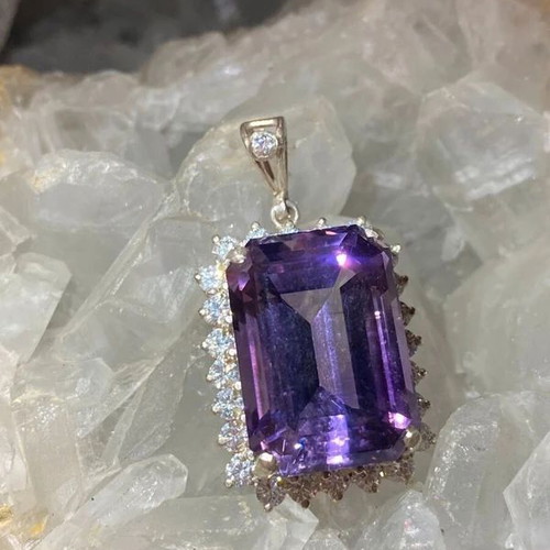 Silver pendant with large cut natural amethyst stone and moissanites