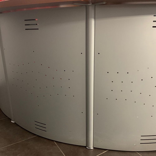 Reception desk used with metal perforated front panel