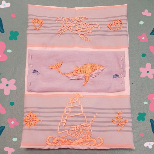 Decorative pillow with golden hand embroidery and sea motifs, new