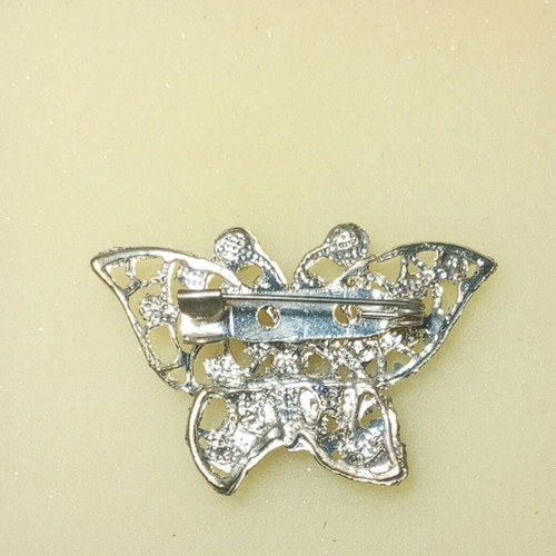 Metal brooch with semi-precious stones like new