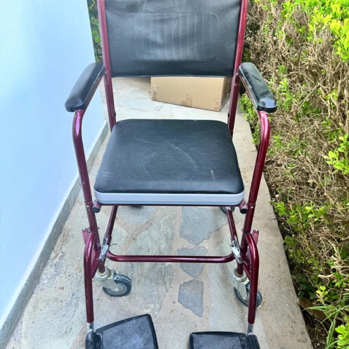 Red toilet wheelchair like new, missing container