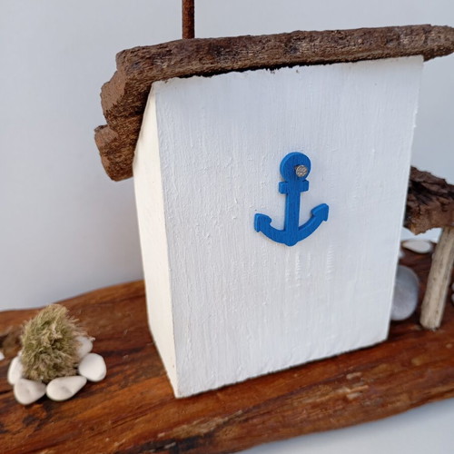 Handmade sea-themed driftwood diorama with Greek island house