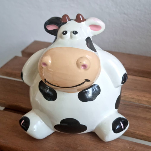 Ceramic cow piggy bank like new, black and white