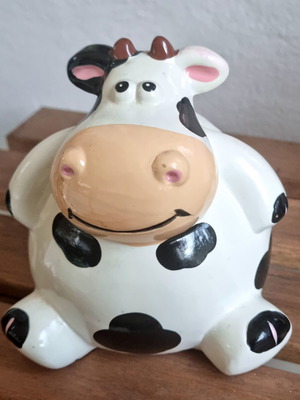 Ceramic cow piggy bank like new, black and white