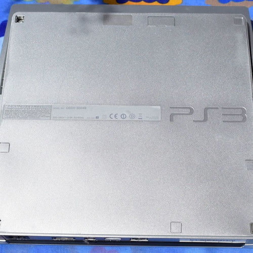 PlayStation 3 Slim 320GB Satin Silver console used with cables and controller