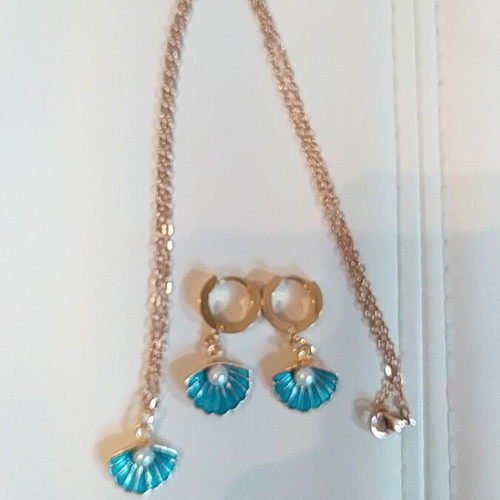 Handmade necklace and earrings set with turquoise and gold colors