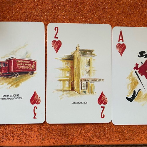 Johnnie Walker collectible playing cards in metal box used