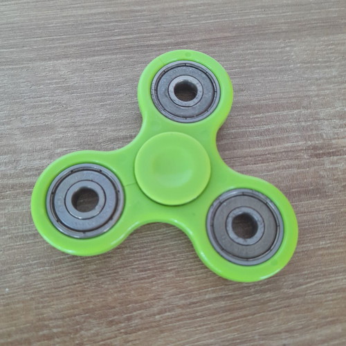 Fidget spinner used, metal with wear