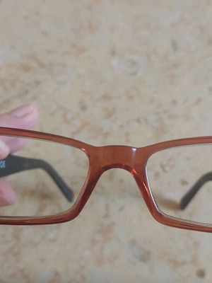 Miu Miu eyeglasses used with purple and orange acetate frame