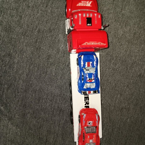 Toy truck like new with two toy cars