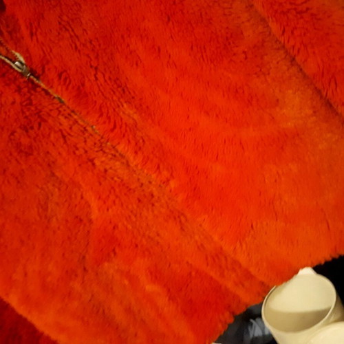 Stradivarius orange fur like new, with torn pocket lining