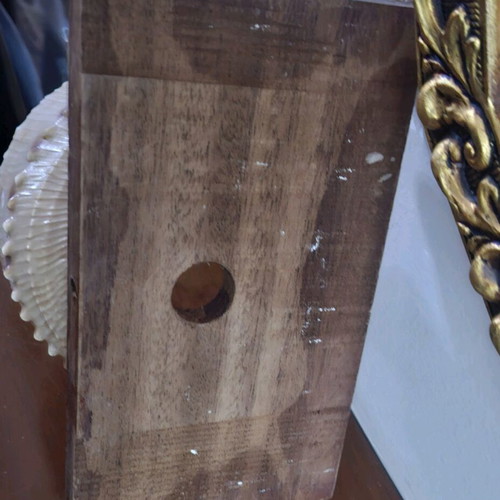 Decorative seashell composition used, wooden base
