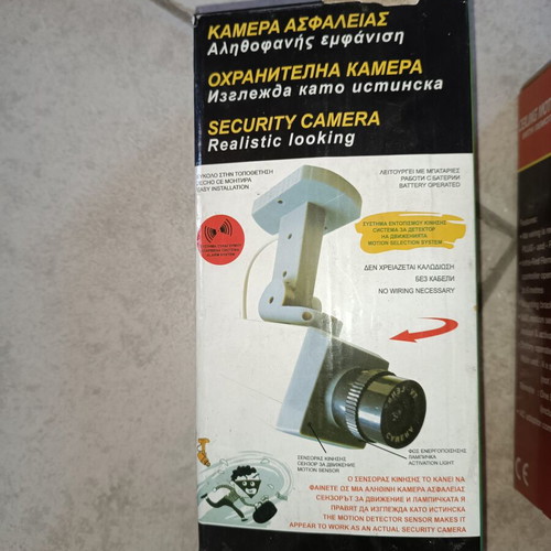 Security package used with ceiling motion alarm, door & window entry alarm, and realistic security camera