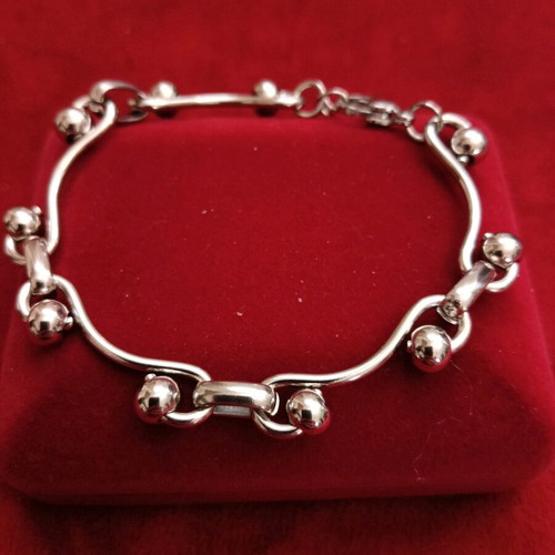 Stainless steel bracelet new, silver with intricate fastening