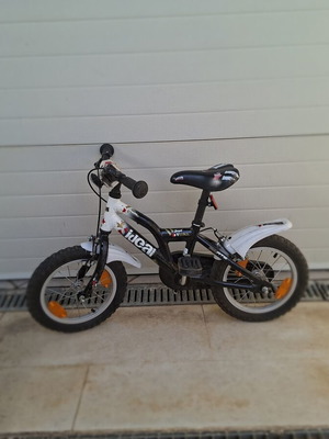 Children's bicycle used, size 14, with handlebar protectors