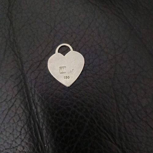 Three heart-shaped charms used, Swarovski crystal, mother of pearl, silver-plated