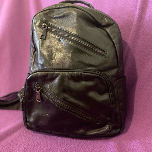 Black backpack bag made of leatherette with many pockets like new