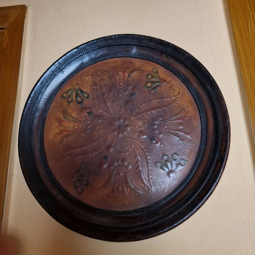 Vintage wooden wall decoration with leather center