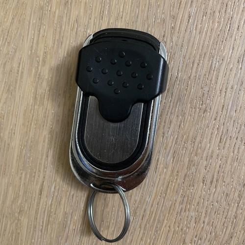 Remote control with cover for garage doors and gates