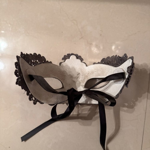 Two ornate masks like new, one gray and one white
