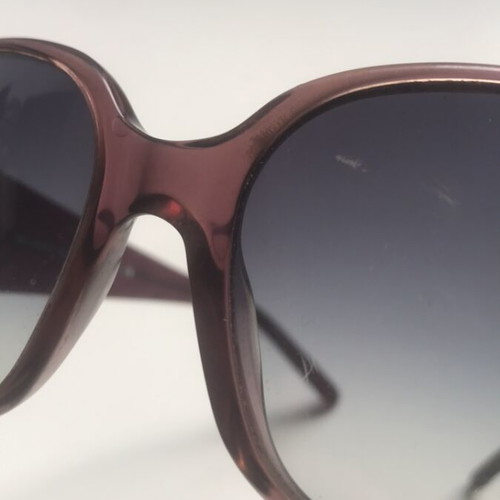 Burberry sunglasses and case used with minor defect