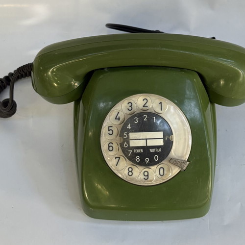 Vintage green telephone used, wired connection