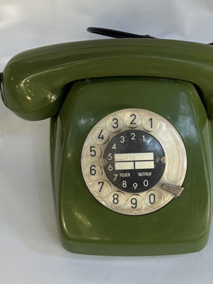 Vintage green telephone used, wired connection