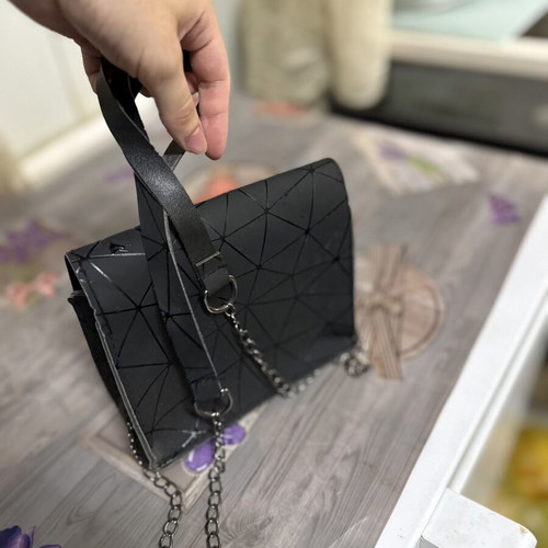 Women's black shoulder bag with geometric design, like new