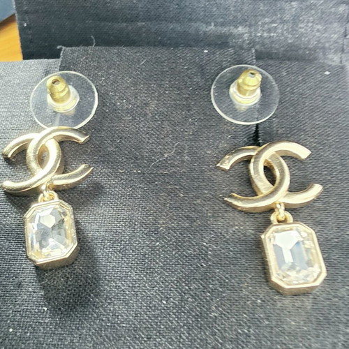 Chanel earrings with white and gold details
